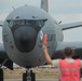 Airman marshals KC-135 on the 121ARW flight line