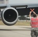 Airman marshals KC-135 on the 121ARW flight line
