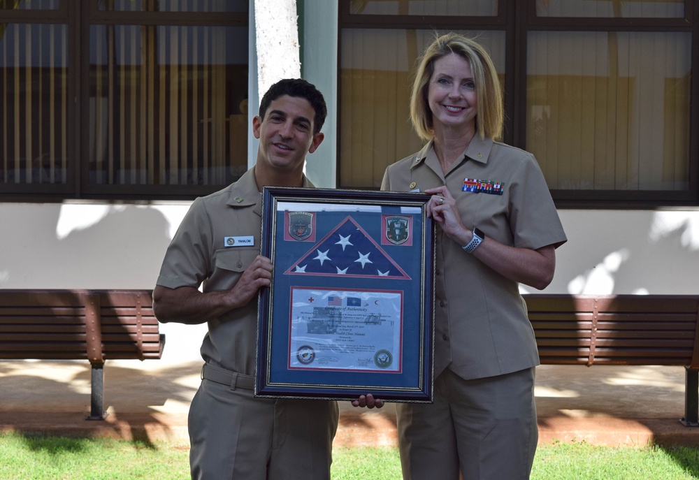 LT Yahlom Presents the Framed Gift to NHCH CO, Capt. Kimberly Zuzelski