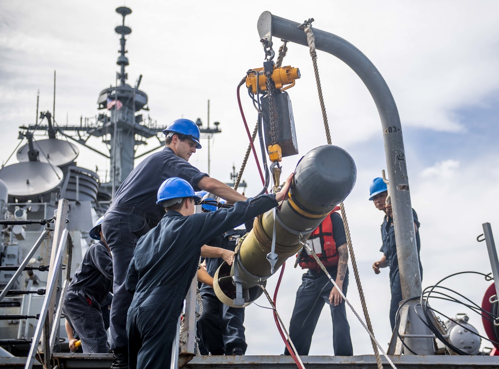 Sailors Aboard USS Milius (DDG 69) Load Mark 46 Torpedos into Mark 32 Surface Vessel Torpedo Tubes