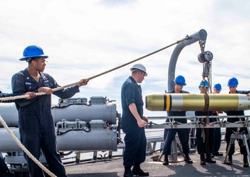 Sailors Aboard USS Milius (DDG 69) Load Mk 46 Torpedos into MK 32 Surface Vessel Torpedo Tubes