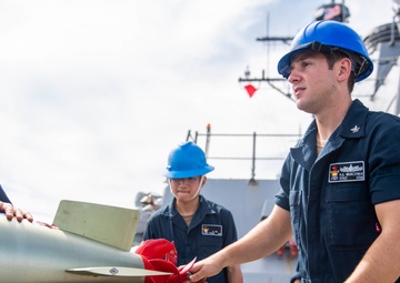 Sailors Aboard USS Milius (DDG 69) Load Mark 46 Torpedos into Mark 32 Surface Vessel Torpedo Tubes
