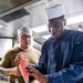 Sailors Aboard USS Milius (DDG 69) Prepare Food for the Crew