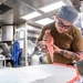 Sailors Aboard USS Milius (DDG 69) Prepare Food for the Crew