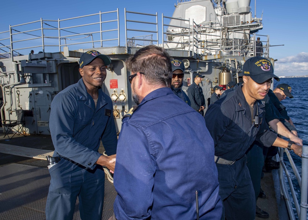 DVIDS - Images - USS Normandy Sailor Greets Pilot [Image 3 of 5]