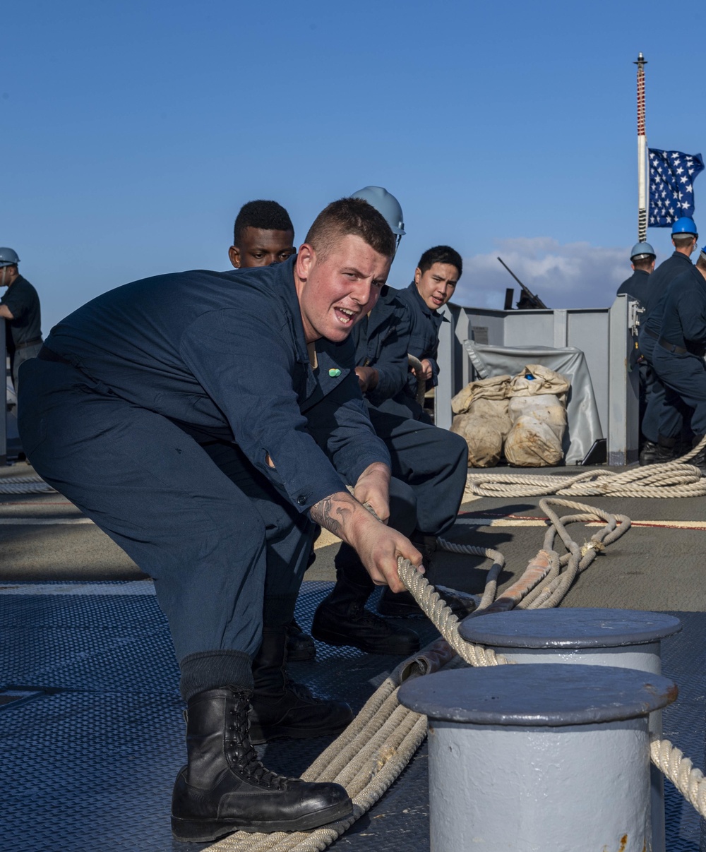 USS Normandy Sailors Heave Mooring Line