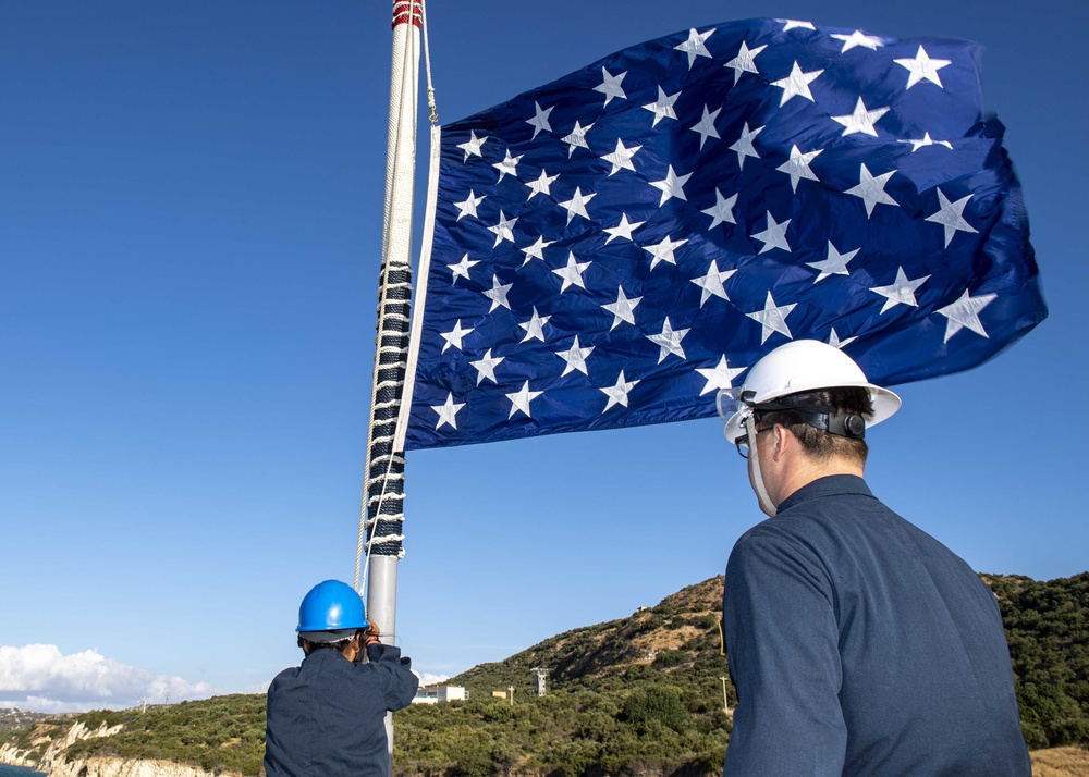 USS Normandy Sailor Hoists Union Jack