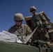 Soldiers set up M777 howitzer