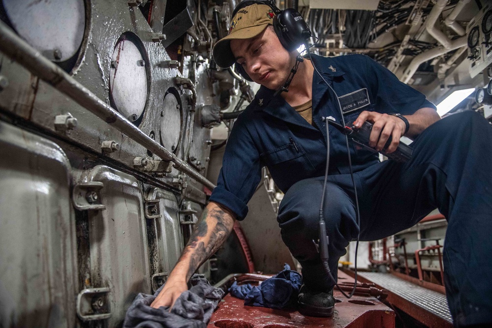 Sailors Work Aboard USS Harpers Ferry