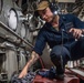 Sailors Work Aboard USS Harpers Ferry