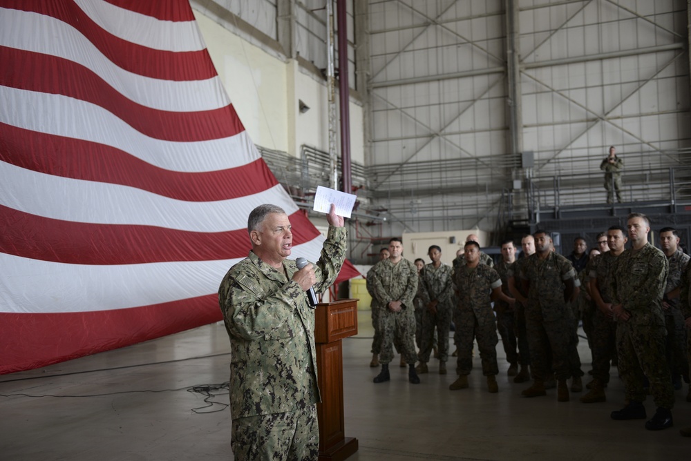 Chief of Naval Personnel, VADM John Nowell, speaks to Sailors in a hangar bay onboard Naval Air Station Sigonella