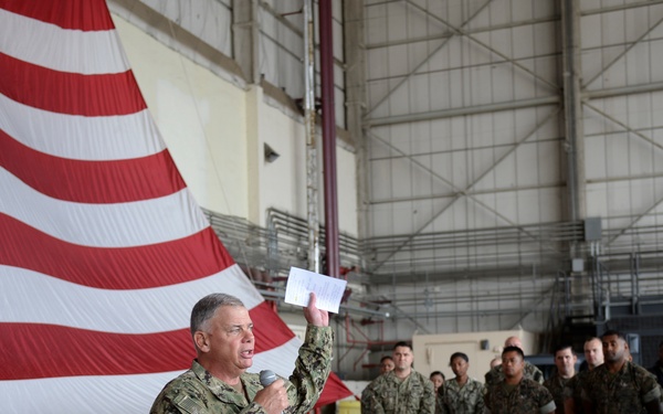 Chief of Naval Personnel, VADM John Nowell, speaks to Sailors in a hangar bay onboard Naval Air Station Sigonella