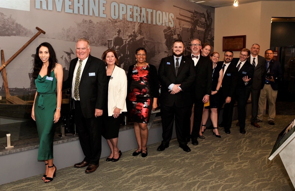 Museum staff members at new exhibit reception