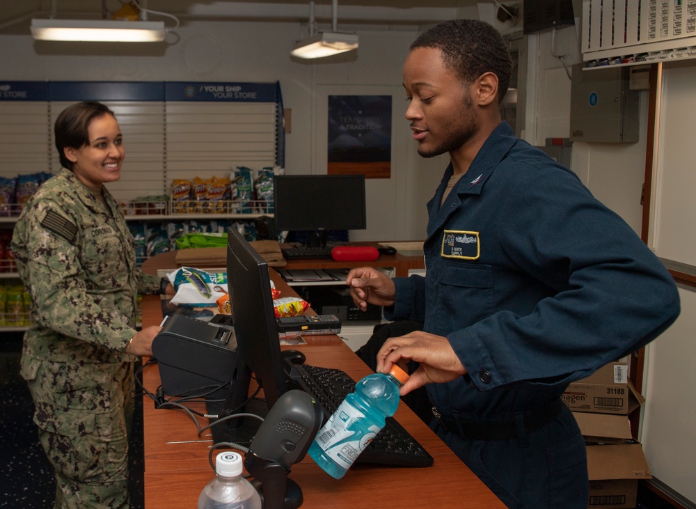 Retail Service Specialist Rings Up A Sailor's Purchase