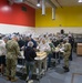 Sailors and Marine Volunteer At Marlin Food Bank