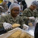 Sailors and Marine Volunteer At Marlin Food Bank