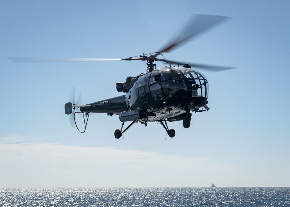 A Belgian Helicopter lands on the USS Gridley