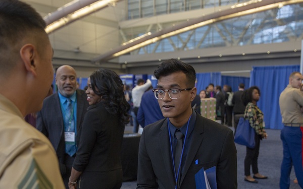 Marines host a career fair booth at the Society of Asian Scientists and Engineers National Conference