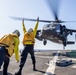 UH-60 Black Hawks from the Army’s 2-2 Assault Helicopter Battalion Conduct Deck Landing Qualifications aboard USS Milius (DDG 69)