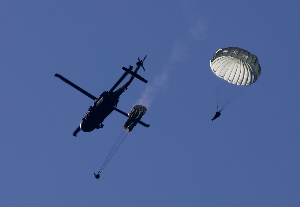  U.S. Army Rangers conducts an airborne jump out of a UH-60 Black Hawk helicopter