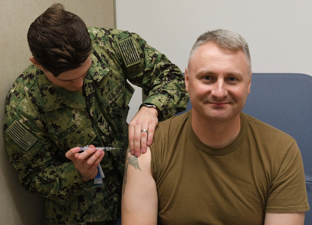 Command Master Chief receives his flu vaccine