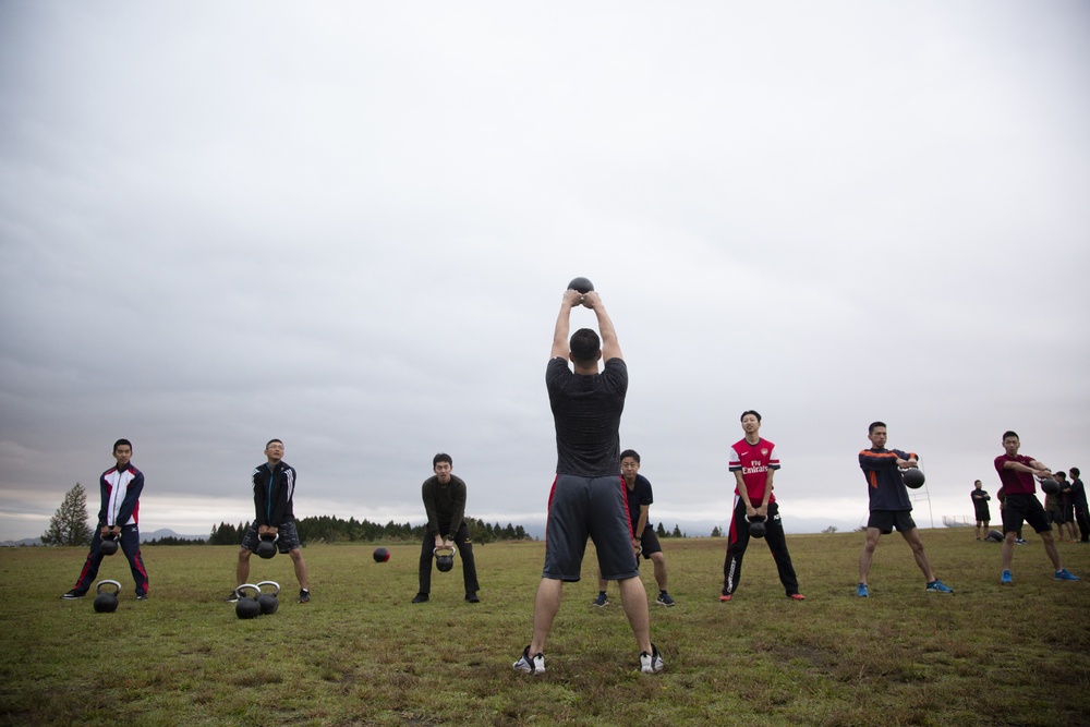 JGSDF service members execute Marine Corps physical training