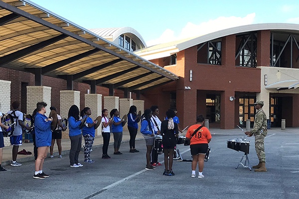 Soldier musician mentors high school marching band