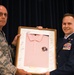 Chief Master Sgt. Terry Hunt hands off the pink polo to Chief Master Sgt. Jeffrey Linton