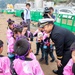 Lt. Saungwon Ko, communications officer of USS Pioneer (MCM 9), speaks with local kindergarteners from Uki city