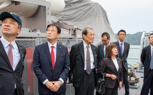 Commanding officer of USS Pioneer (MCM 9), Lt. Cmdr. Bobby Wayland, gives a ship tour to the mayor of Uki city, Kenshi Morita and his staff.
