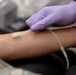 USAF EC gives blood in memory of teammate