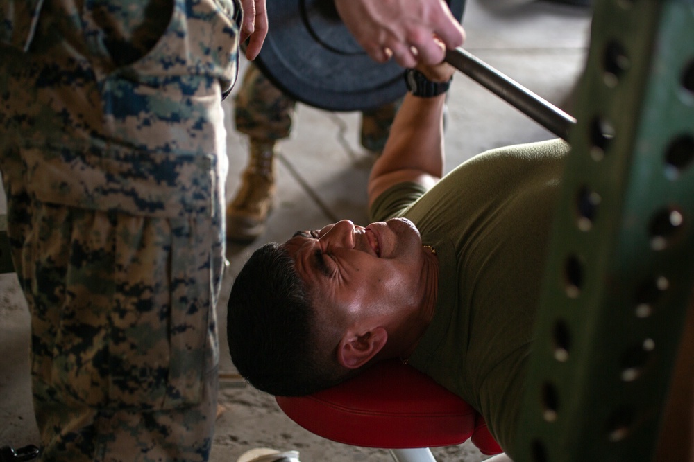 Marines, Sailors participate in a bench press competition during exercise KAMANDAG 3