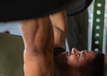 U.S. Marines, Sailors participate in a bench press competition during exercise KAMANDAG 3