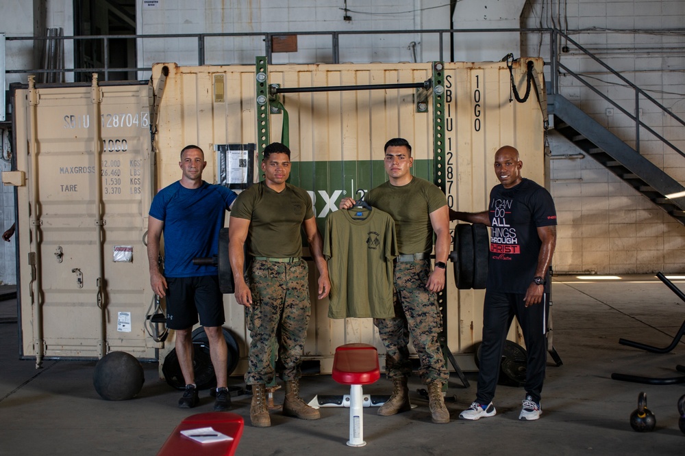 U.S. Marines, Sailors participate in a bench press competition during exercise KAMANDAG 3