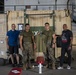 U.S. Marines, Sailors participate in a bench press competition during exercise KAMANDAG 3