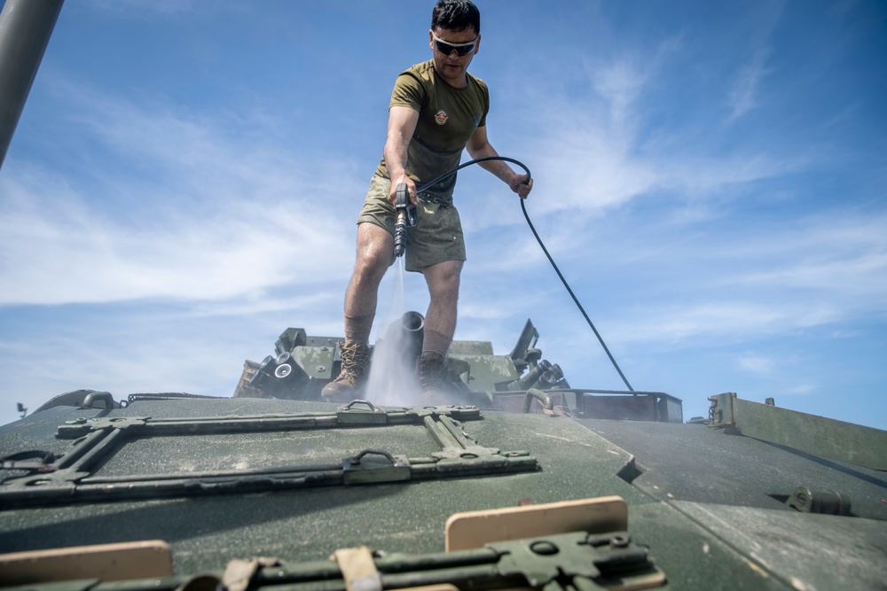 11th MEU Marine washdown their vehicles and backload onto the USS John P. Murtha after exercise KAMANDAG 3