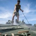 11th MEU Marine washdown their vehicles and backload onto the USS John P. Murtha after exercise KAMANDAG 3