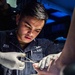 A Sailor Aboard USS Milius (DDG 69) Performs Medical Care