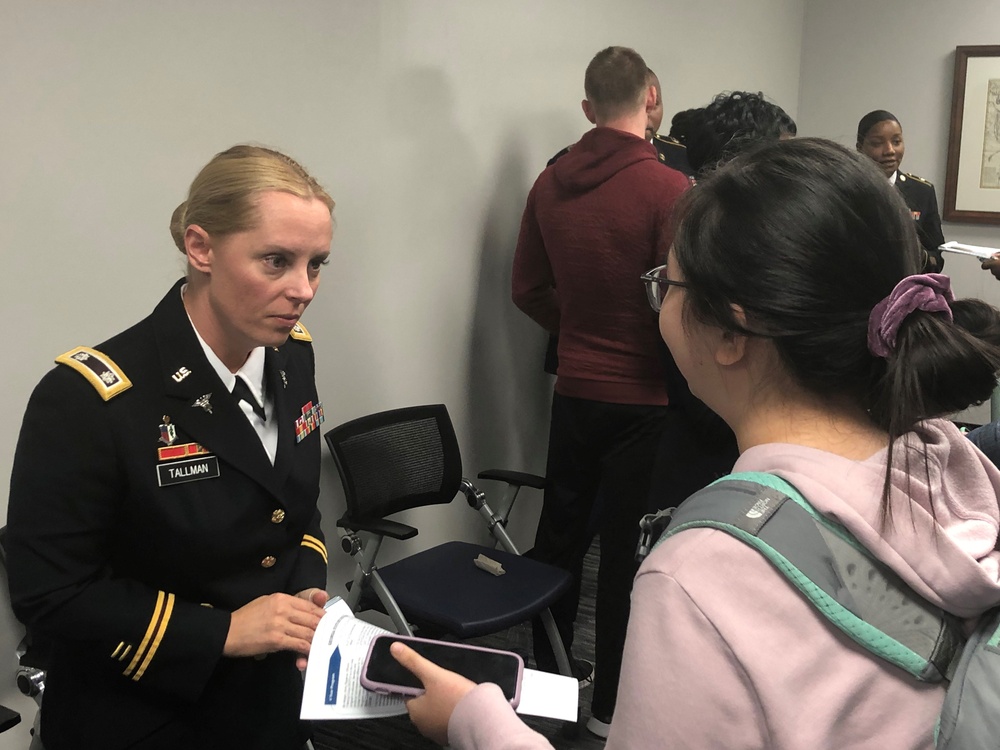 LTC Susan Tallman speaks with a student following panel discussion