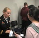 LTC Susan Tallman speaks with a student following panel discussion