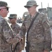 Maj. Gen. John P. Sulivan presents coins to 129th CSSB soldiers