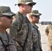 Maj. Gen. John P. Sulivan presents coins to 129th CSSB soldiers