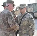 Maj. Gen. John P. Sulivan presents coins to 129th CSSB soldiers