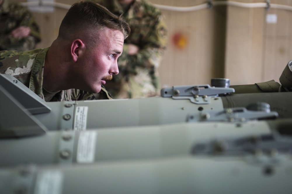 386 EMXS munitions Airmen demonstrate bomb building