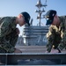 U.S. Navy Sailors perform maintenance on flight deck of USS John C. Stennis