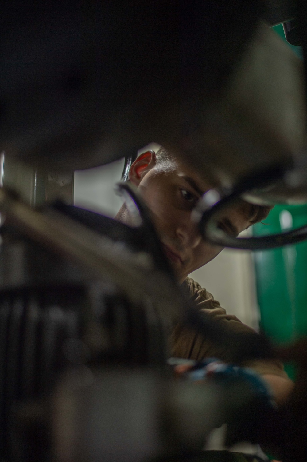 U.S. Navy Sailor performs maintenance