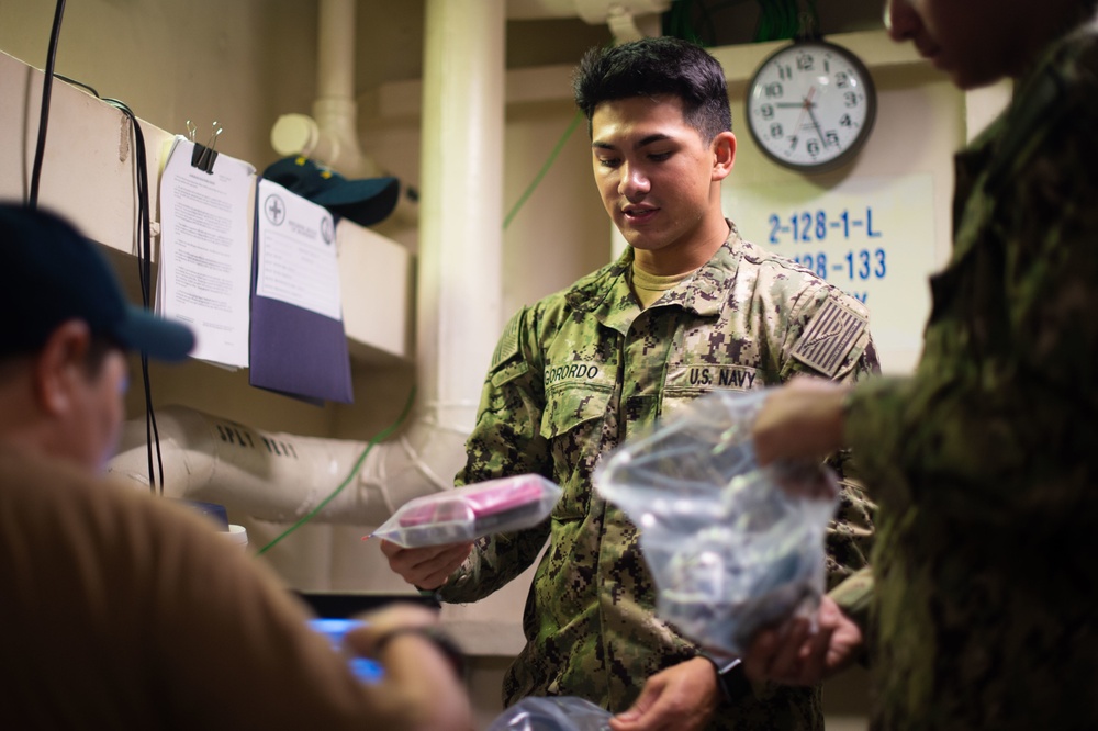 A Sailor receives a respirator