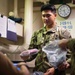 A Sailor receives a respirator