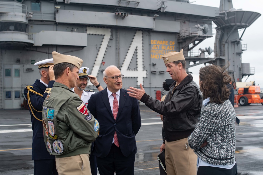 U.S. Navy Capt. J. Patrick Thompson, center right, executive officer of the aircraft carrier USS John C. Stennis