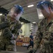 U.S. Sailors band a box